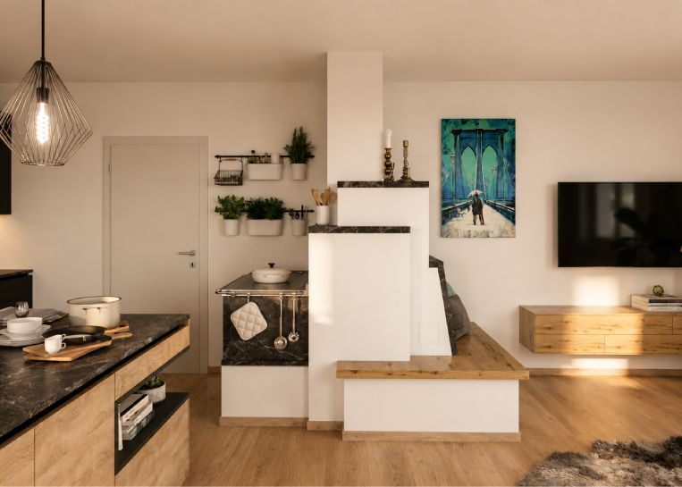 Perspektive auf die kombinierte Ofenanlage, die Küche und Wohnzimmer als funktionaler Raumteiler verbindet.