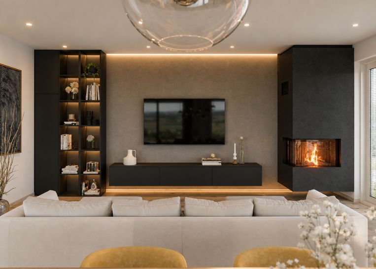 Perspektive auf den deckenhohen schwarzen Kamin im Kontext einer modernen Wohnlandschaft mit TV-Board und indirekter Deckenbeleuchtung.